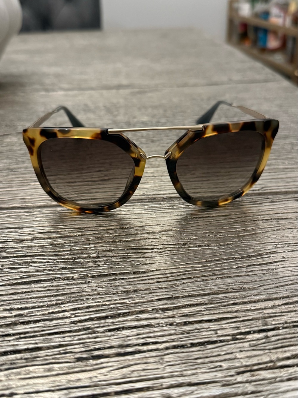 Prada Tortoiseshell Cat-Eye Sunglasses with Gold Bridge